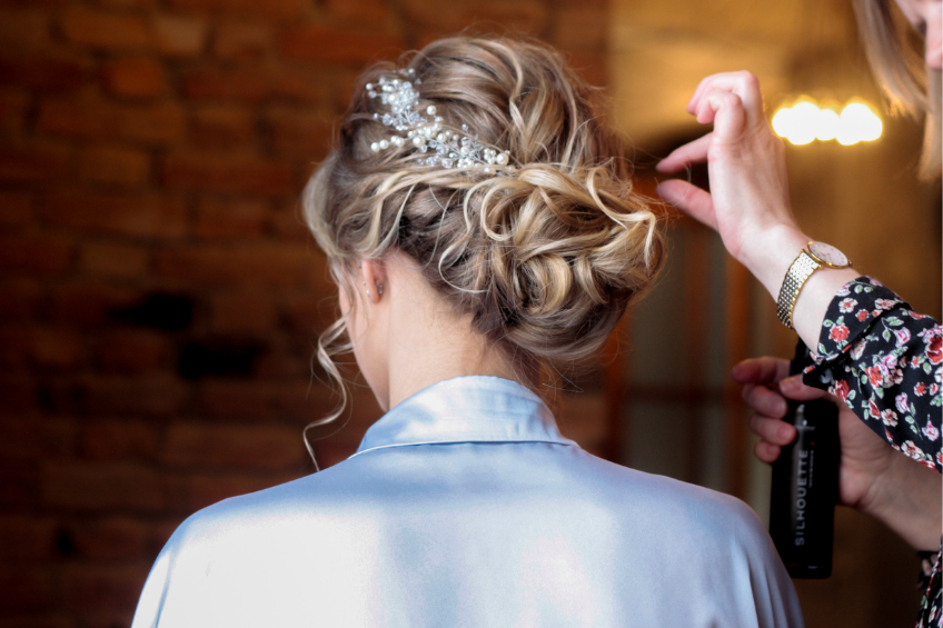Updo Blonde_ by Ксения from Pexels Rear view of you women with long blonde hair as a stylist arranges a formal bouffont style