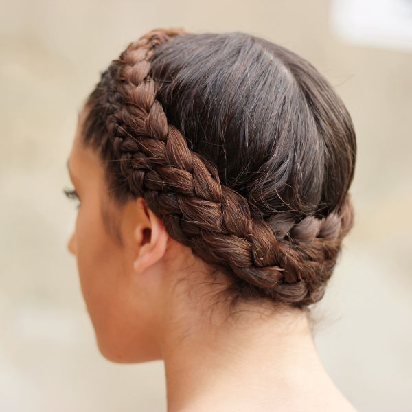 Braide Crown by Amy Shaughnessy from Getty Images Example of braided crown hairstyle showing a women's hairstyle from a rear view.