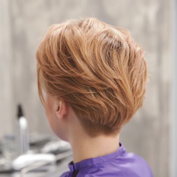 Testured Style by pixelshot Rear view of salon client with short auburn hair styled for texture