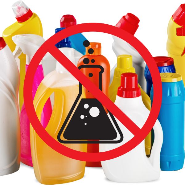 Image background bottle of unnamed chemcials with a large red danger Icon on top.