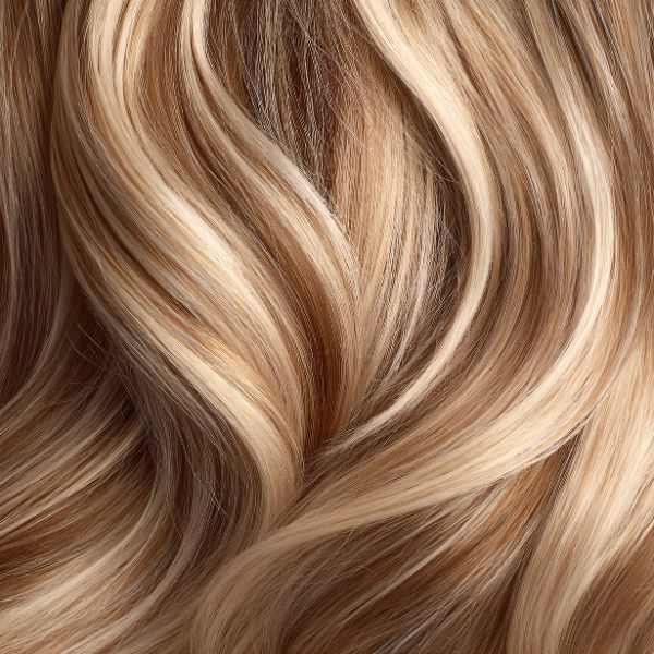 Closeup of dimensional hair coloring showing light and color combined