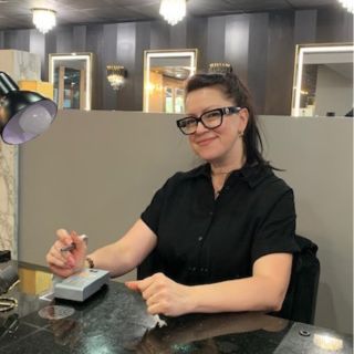 Professional Nail technician Viktorria at her Manicure woek station