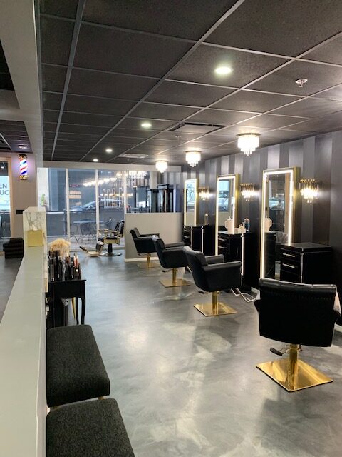 Calon Baci interior view with elegant design and indirect lighting over the customer service chairs