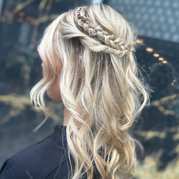 Salon Baci client rearview of striking blonde highlighted hair in an Bufount Updo